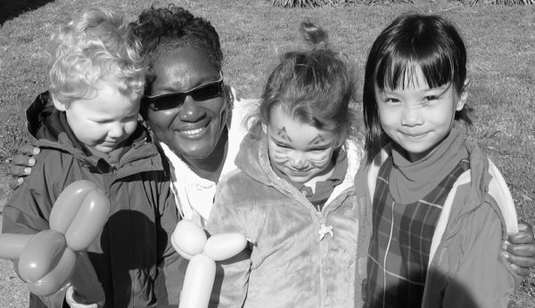 A teacher with 3 of her toddler students